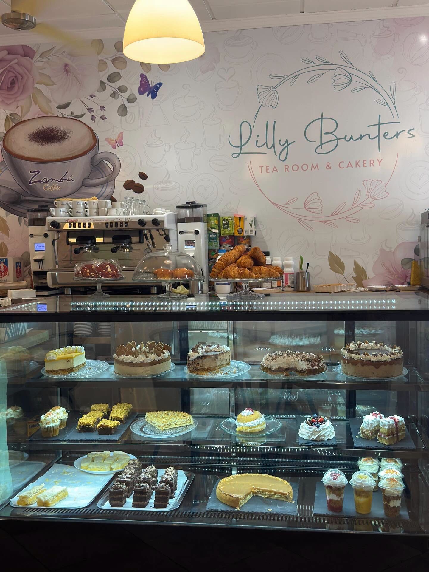The Lilly Bunters counter, filled with cakes, croissants and a coffee machine